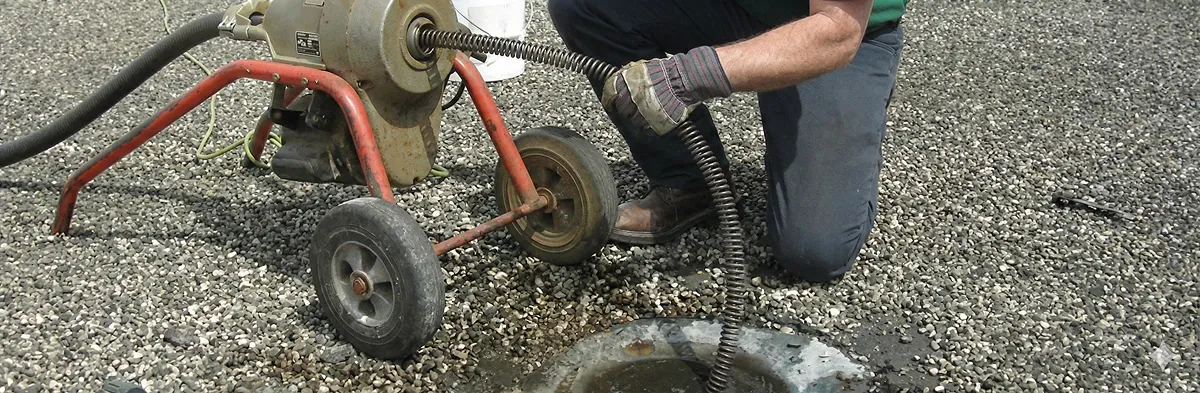sewer rodding technician actively removing blockages from a sewer line in San Francisco, CA